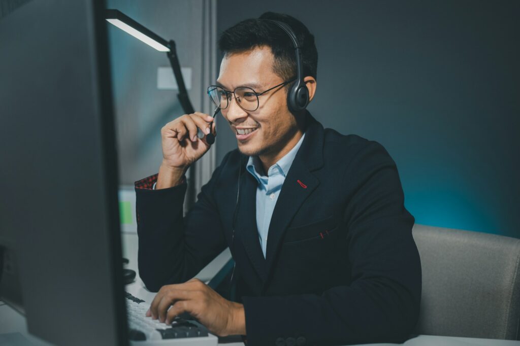 Call center employee talking with customer through headset, The operator is providing customer servi